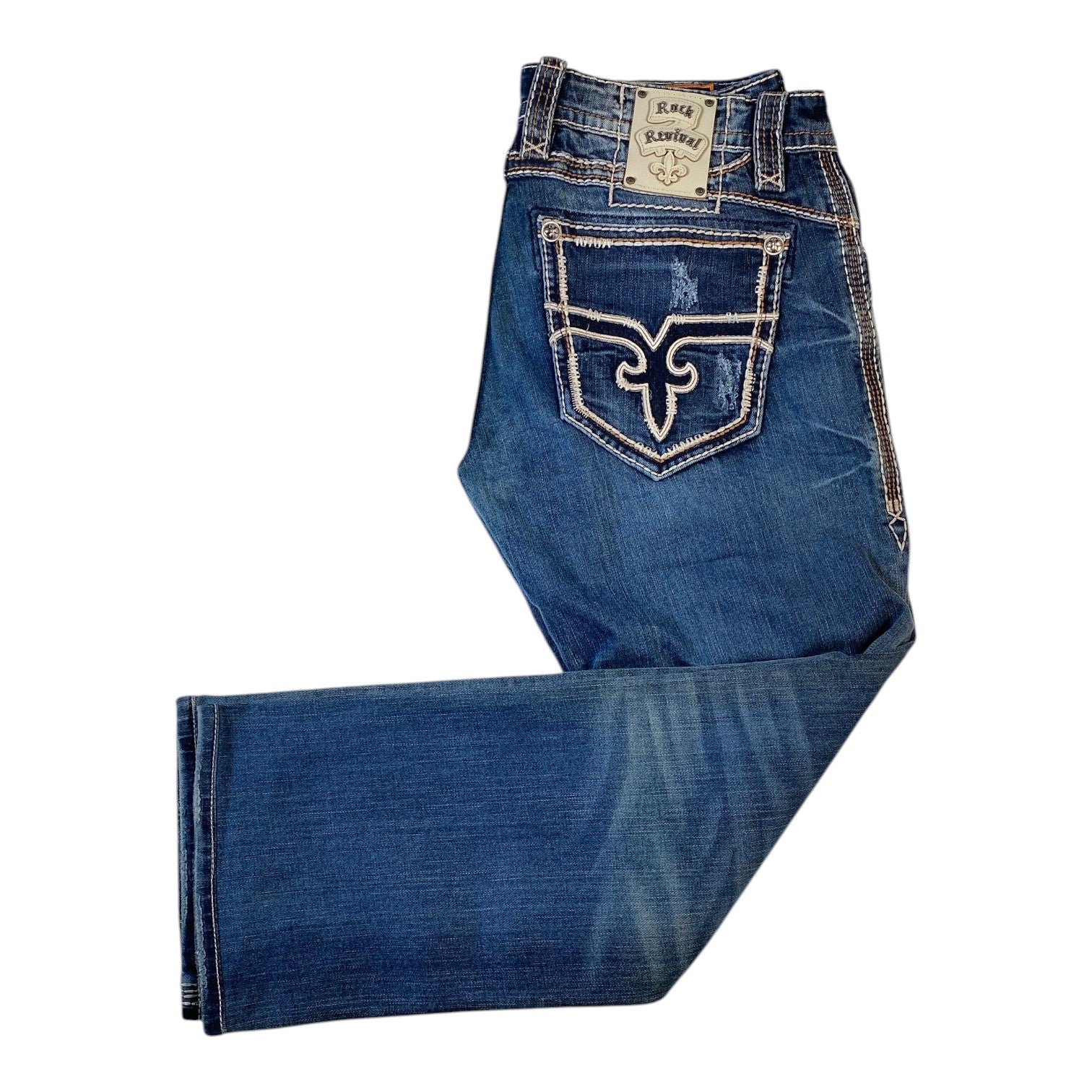 A pair of blue denim jeans folded to show the back pocket area, featuring a prominent white embroidered wing logo on the pocket and contrast stitching, set against a plain white background.