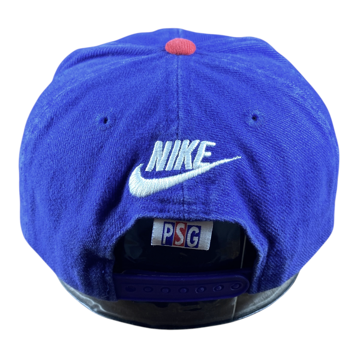 Digg It Thrift & Vintage Nike x Paris Saint-Germain blue snapback cap with white logo and red button detail