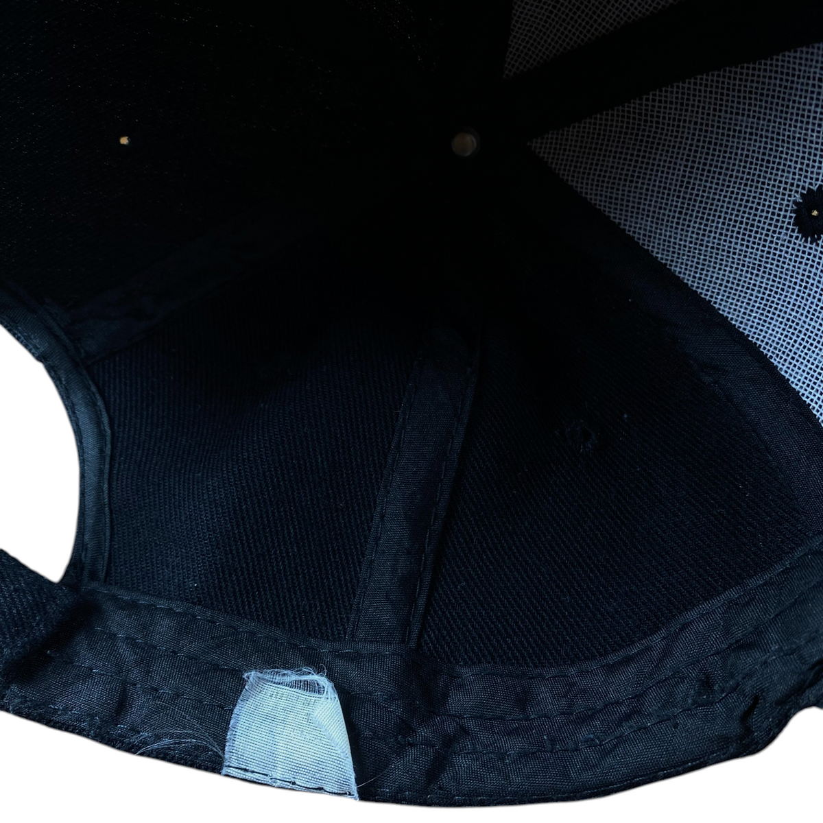 Interior view of a black Digg It Thrift & Vintage Harley-Davidson baseball cap showing the structured crown lining
