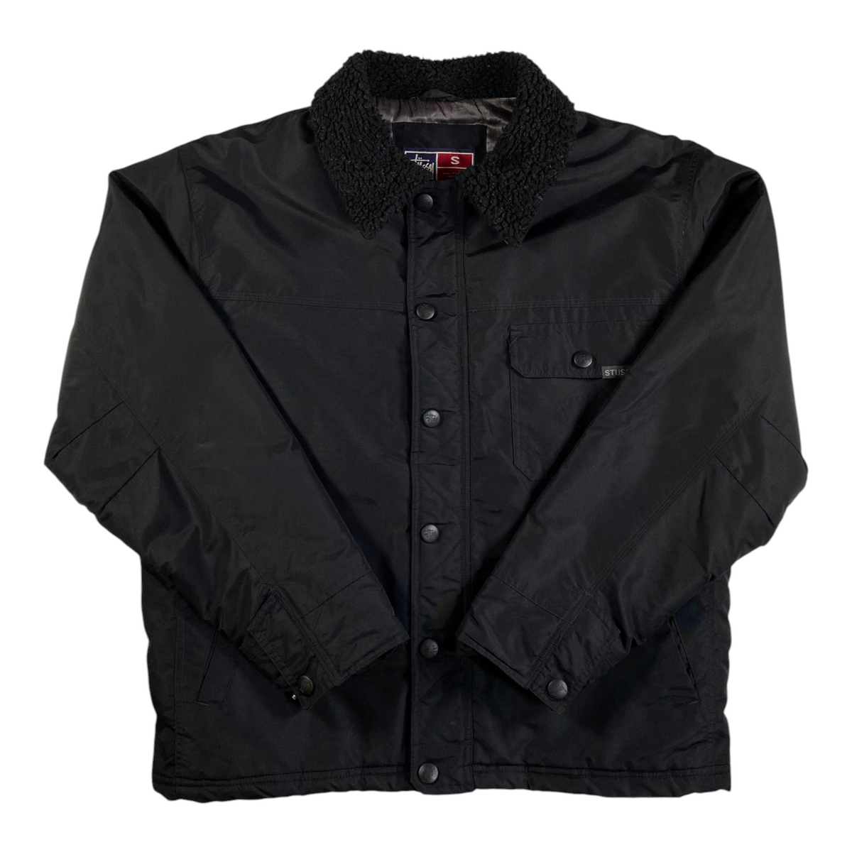 Digg It Thrift & Vintage black Stüssy insulated workwear jacket with a textured sherpa collar and snap-front closure.