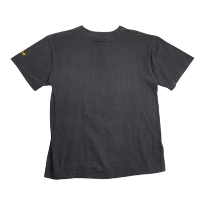 Back view of a faded black Digg It Thrift & Vintage graphic t-shirt with a small yellow detail on the sleeve.