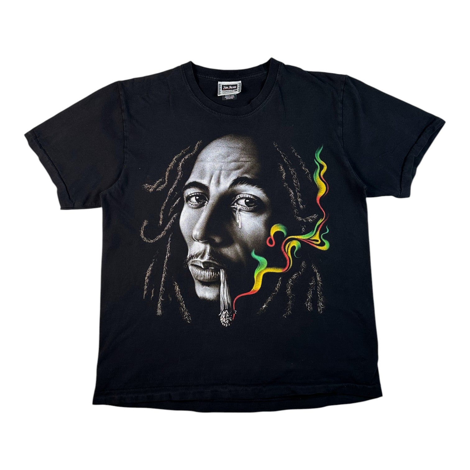 A black short-sleeve crewneck t-shirt featuring a graphic print of Bob Marley's face with a joint in his mouth and colorful green, yellow, and red smoke, shown against a plain white background.