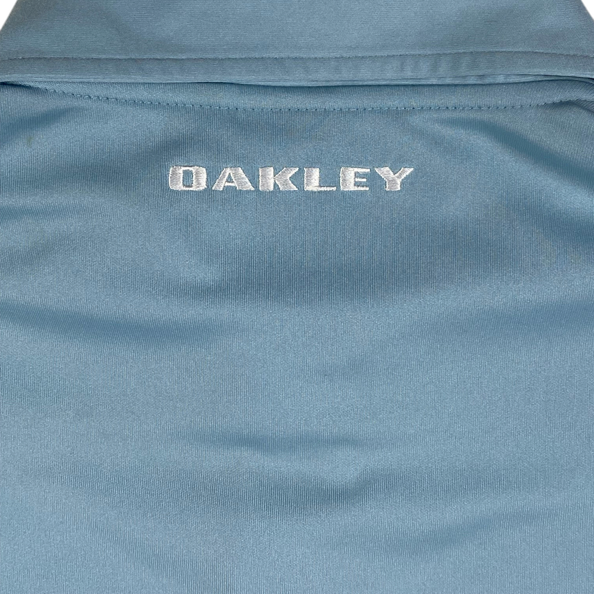 Digg It Thrift & Vintage light blue Oakley athletic golf polo shirt with embroidered logo detail