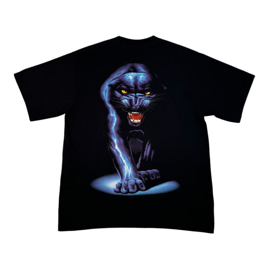 A black short-sleeve t-shirt featuring a large graphic print of a glowing blue panther with yellow eyes and an open mouth showing red teeth, set against a plain white background.