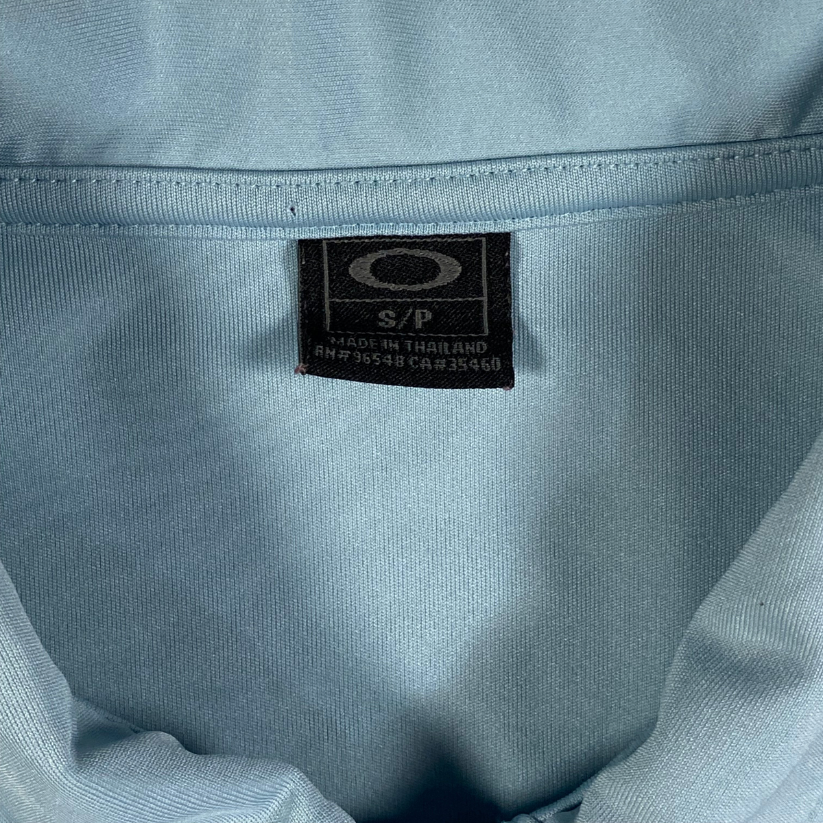 Digg It Thrift & Vintage light blue Oakley athletic golf polo shirt size small tag detail
