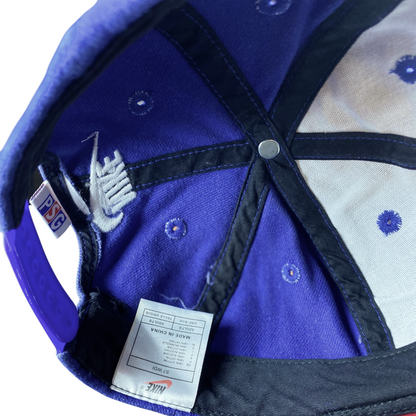 Interior view of a Digg It Thrift & Vintage Nike x PSG snapback cap showing the Nike logo and care label