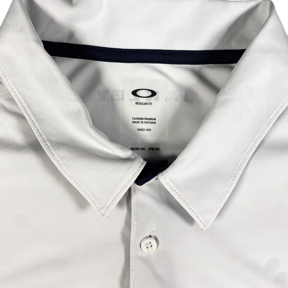 Digg It Thrift & Vintage white Oakley athletic golf polo shirt with collar and button placket, size 2XL