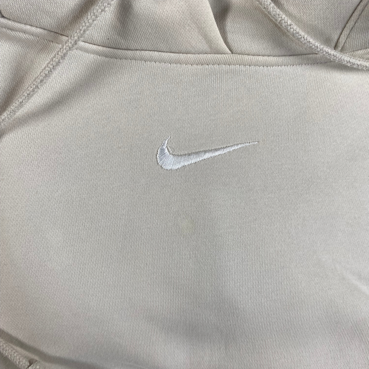 Digg It Thrift & Vintage cream Nike pullover hoodie with a small embroidered white center swoosh logo
