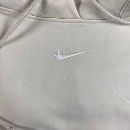 Digg It Thrift & Vintage cream Nike pullover hoodie with a small embroidered white center swoosh logo