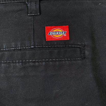 Digg It Thrift & Vintage dark grey Dickies work pants featuring a signature red logo patch on the back pocket