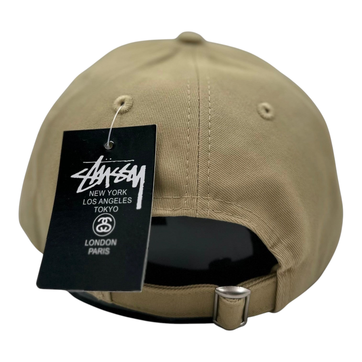 Digg It Thrift & Vintage Stussy beige cotton twill cap with adjustable metal strap and brand tag on back view