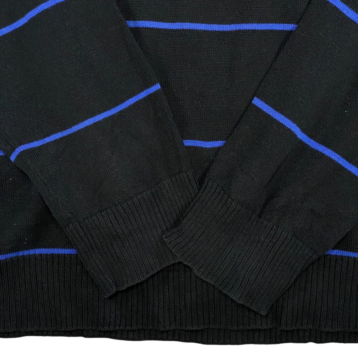 Digg It Thrift & Vintage Teddy Smith black knit sweater with royal blue horizontal stripes and ribbed cuffs