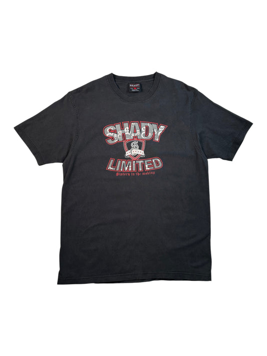 A black short-sleeve t-shirt with a distressed graphic on the chest reading 'SHADY LIMITED' in red and white, featuring a small character graphic in the center, displayed flat against a white background.