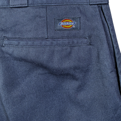 Digg It Thrift & Vintage navy blue Dickies 874 work pants featuring a rear pocket with the iconic Dickies logo patch