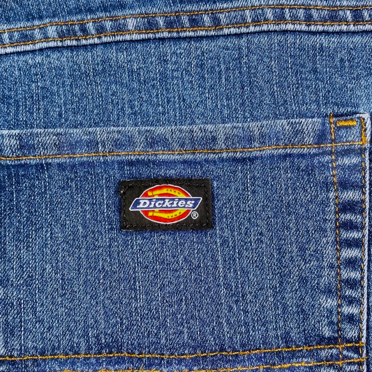 Digg It Thrift & Vintage Dickies Flex blue denim jeans back pocket with classic logo patch and orange stitching
