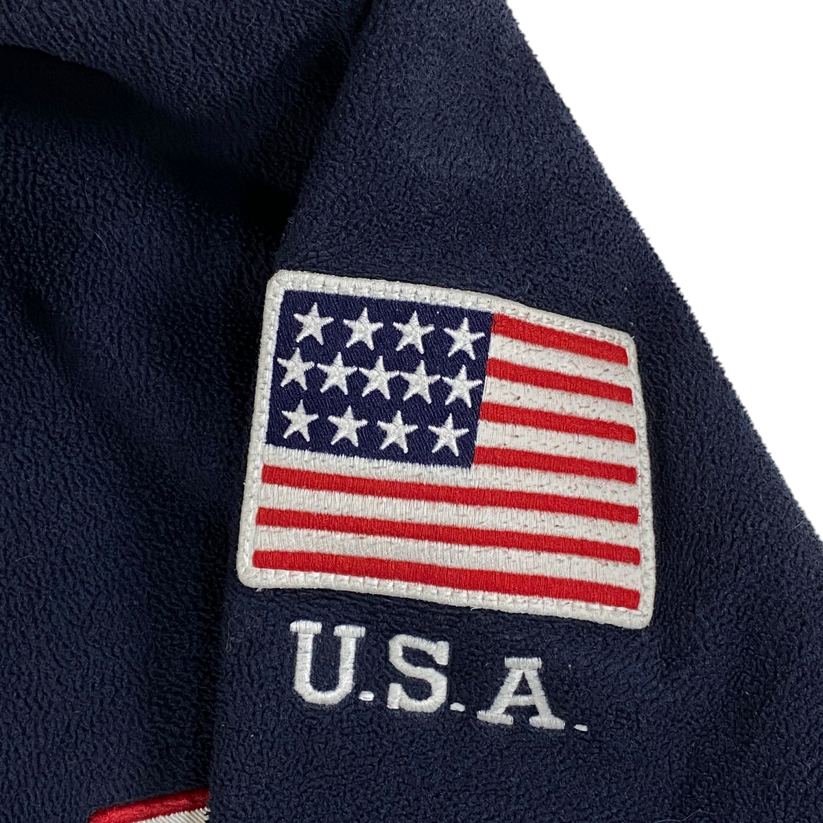 Digg It Thrift & Vintage navy blue fleece sweatshirt featuring a detailed USA flag patch and U.S.A. embroidery.