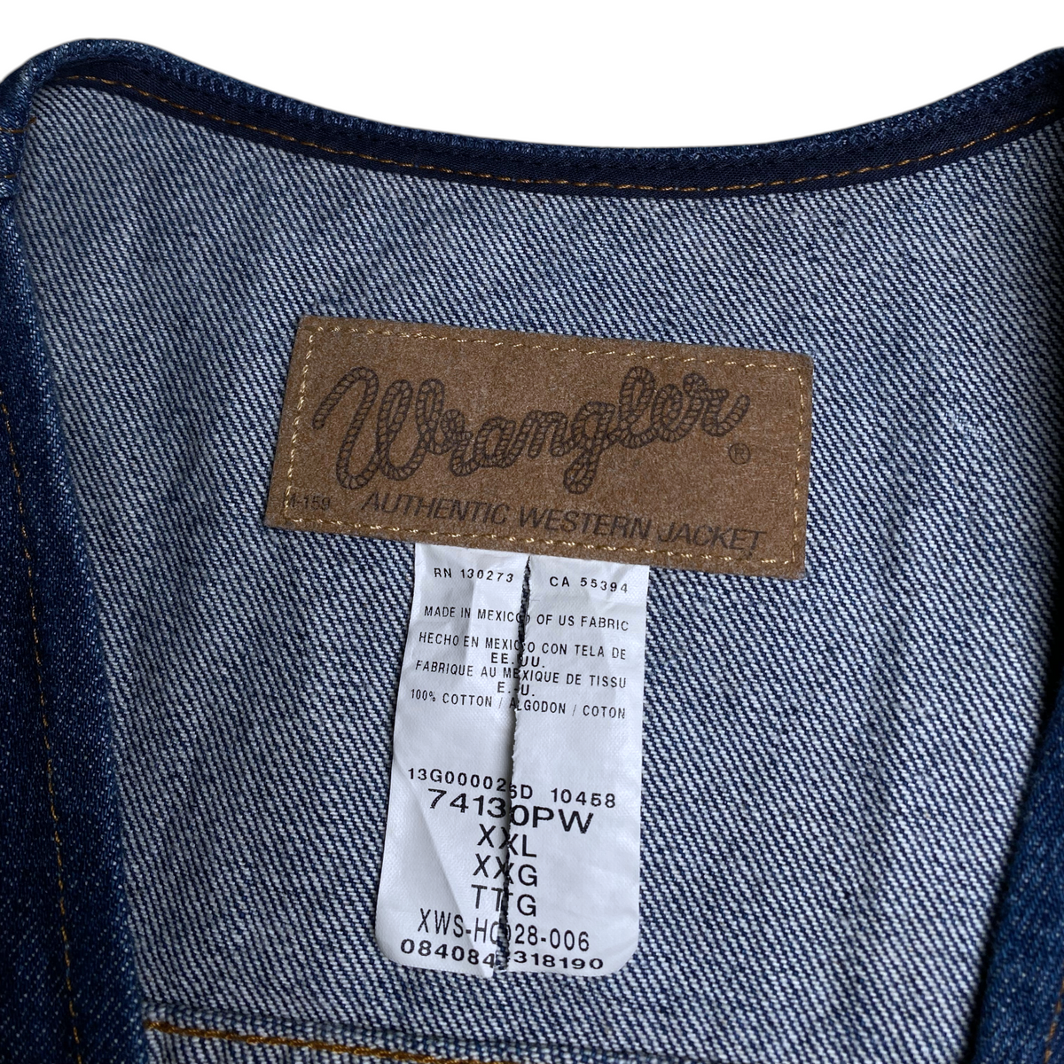 Digg It Thrift & Vintage Wrangler blue denim vest interior label showing size 2XL and 100% cotton material details