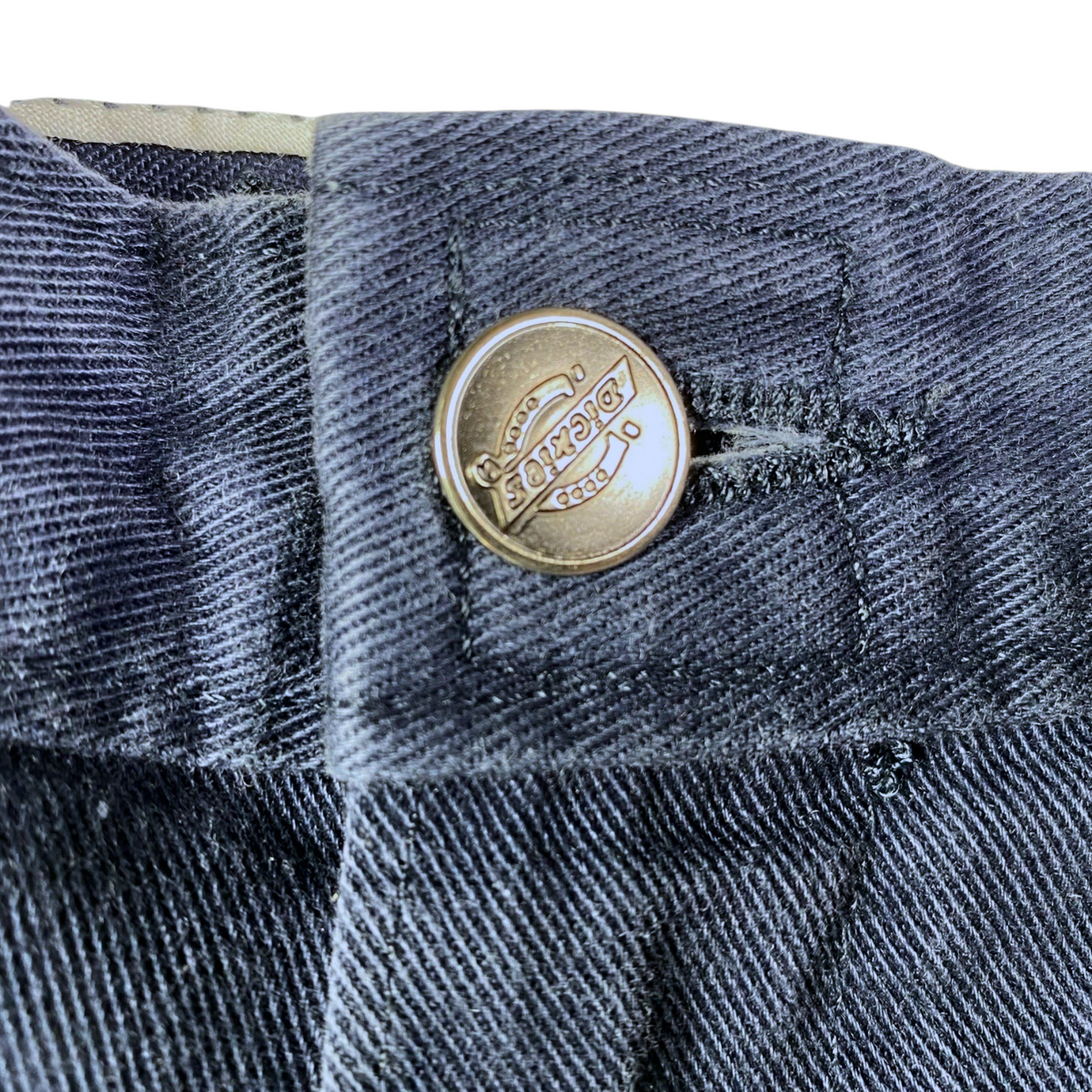 Digg It Thrift & Vintage navy Dickies work pants featuring a branded metal button closure and durable twill fabric.