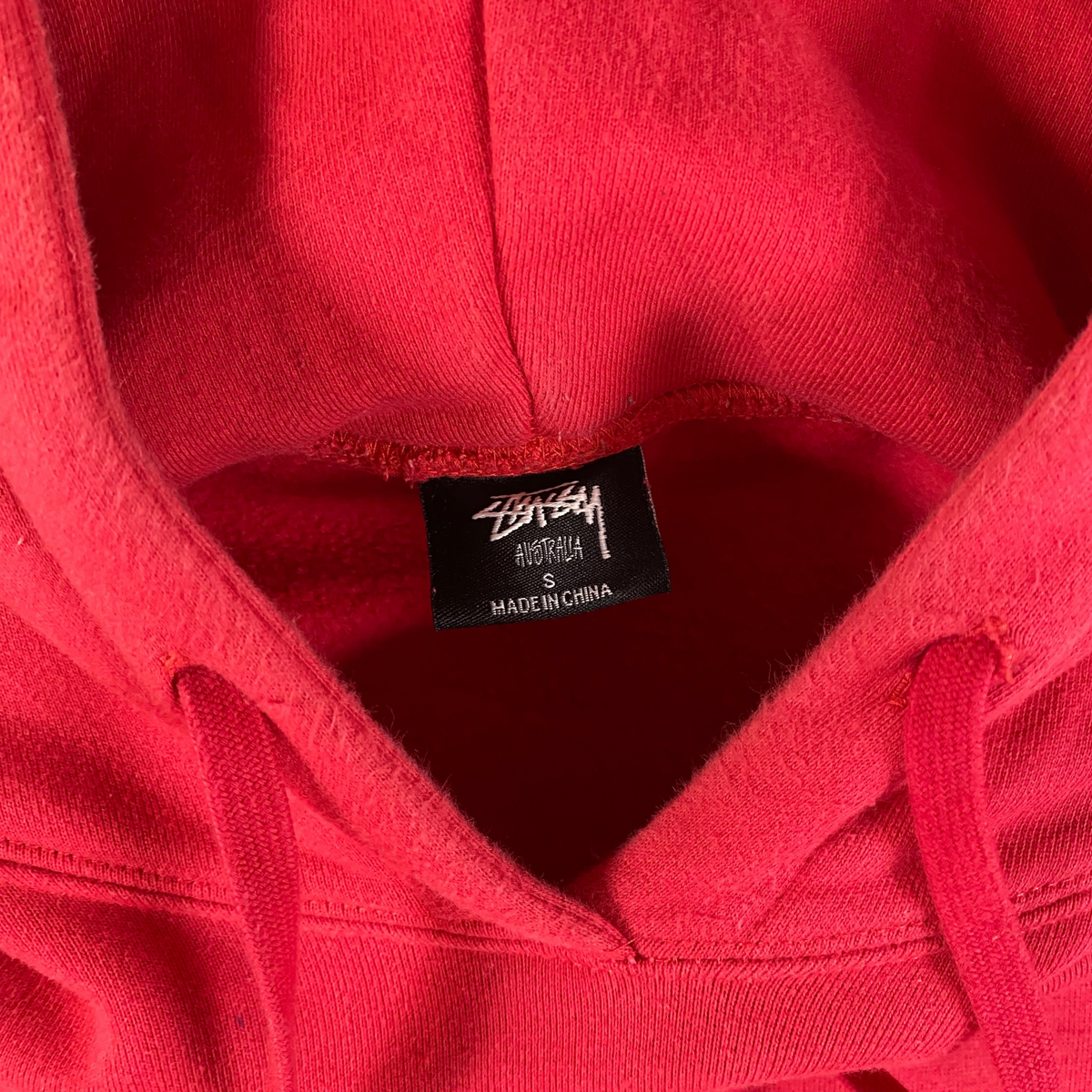 Digg It Thrift & Vintage red Stüssy Australia pullover hoodie with size small neck label