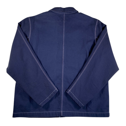 Back view of a Digg It Thrift & Vintage navy canvas chore jacket by Nike Life with white contrast stitching.