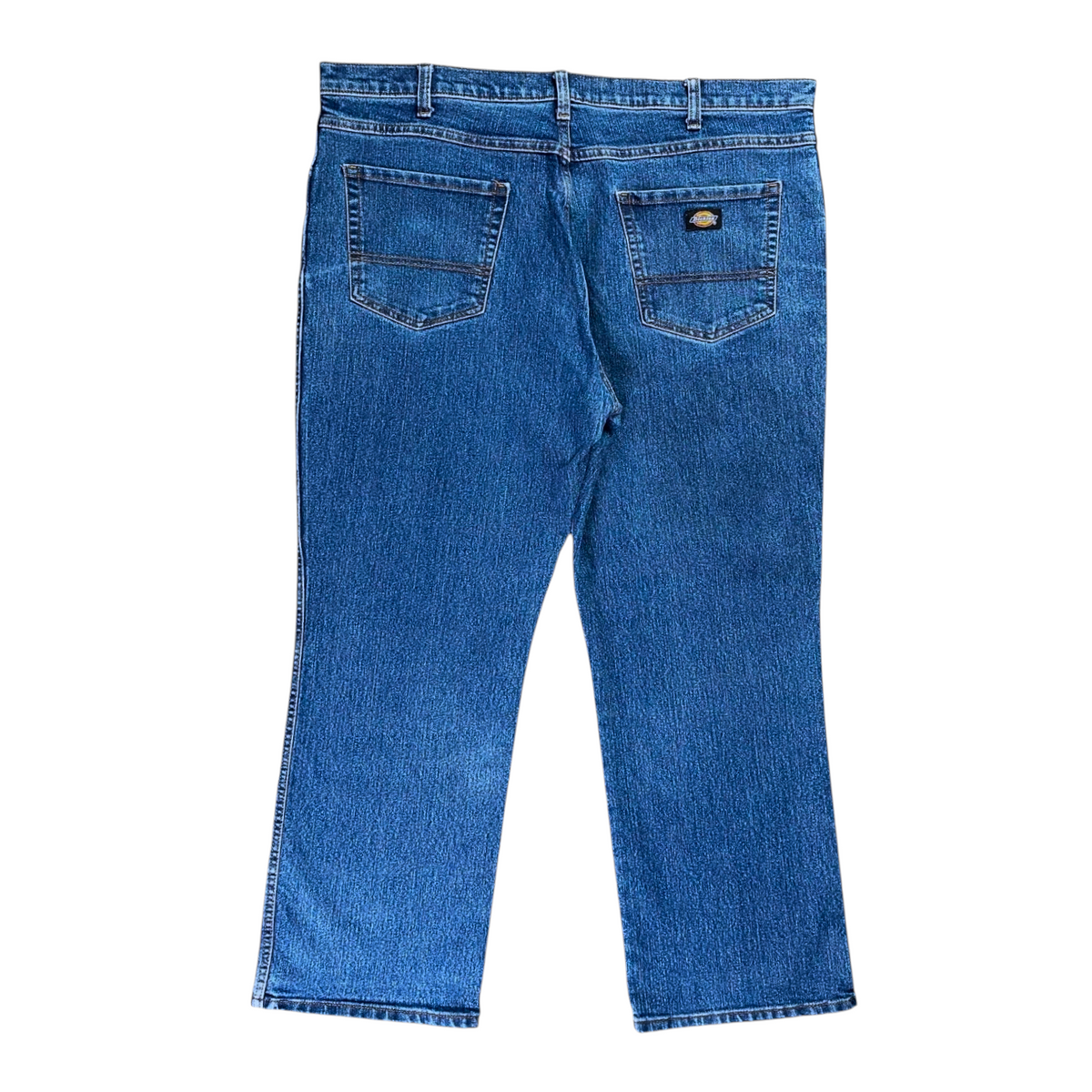 Digg It Thrift & Vintage Dickies Flex straight-leg blue denim jeans, back view showing pockets and logo patch.