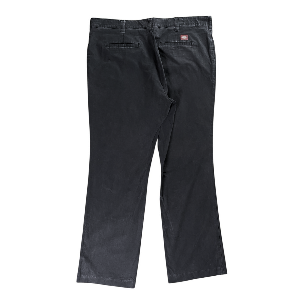 Back view of Digg It Thrift & Vintage Dickies dark grey straight-leg work pants with a small red logo patch