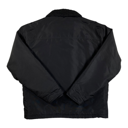 Digg It Thrift & Vintage black Stüssy insulated workwear jacket with snap-front closure and long sleeves