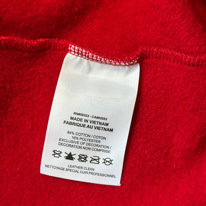 Digg It Thrift & Vintage Nike x Supreme hoodie care label showing cotton polyester blend and leather clean instructions