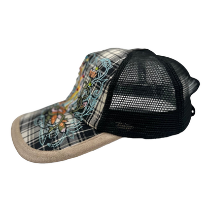 Digg It Thrift & Vintage Y2K trucker cap with plaid brim, rhinestone skull embroidery, and black mesh back panels.