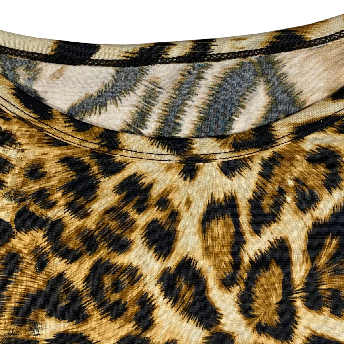 Digg It Thrift & Vintage animal print poncho top featuring a round neckline and soft fabric texture.