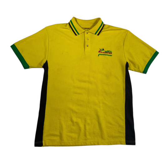 Digg It Thrift & Vintage yellow polo shirt with Jamaica embroidery, green striped collar, and black side panels.