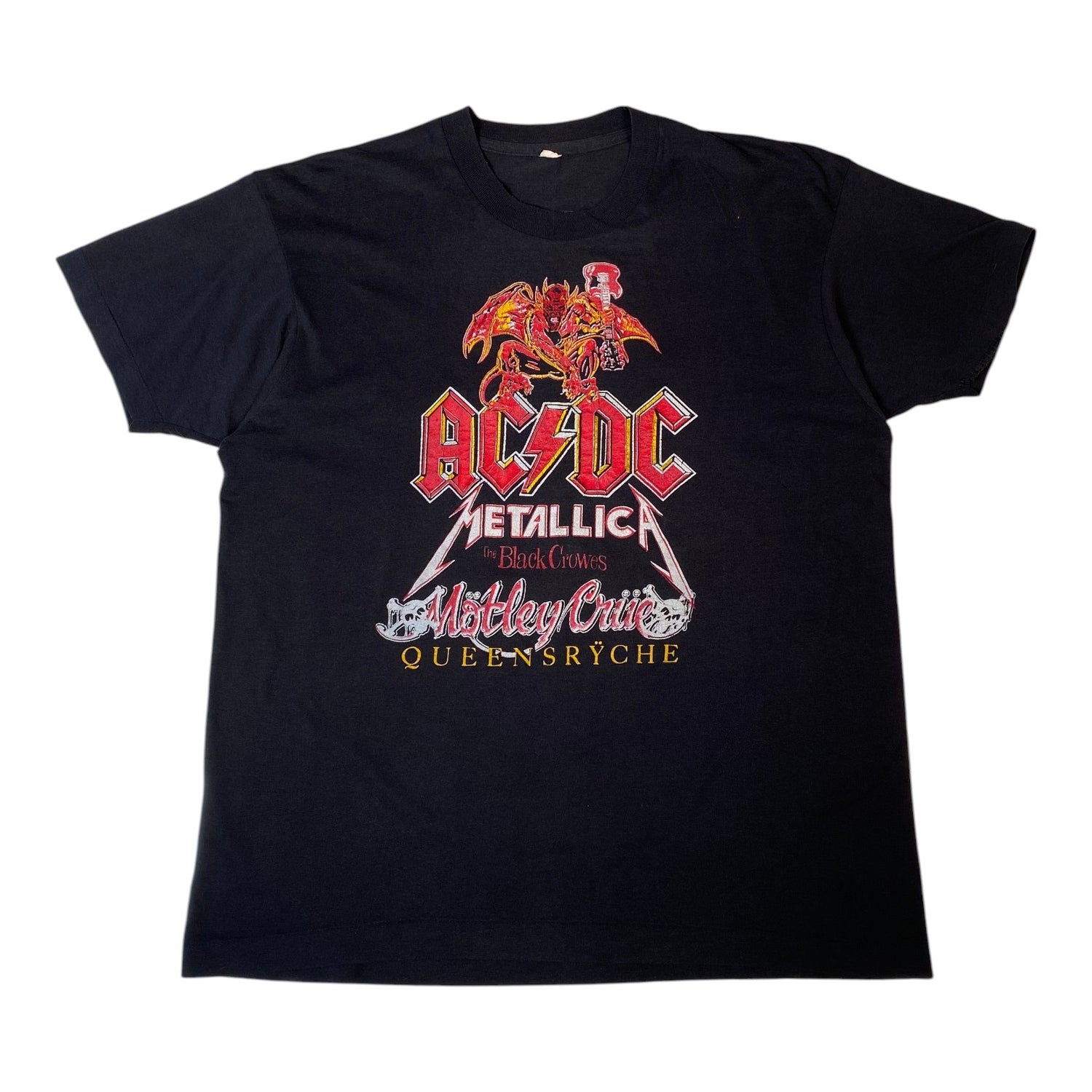 A black short-sleeve graphic t-shirt featuring the AC/DC Metallica 'Blind Eyes' show in Metz, France, printed on the front.