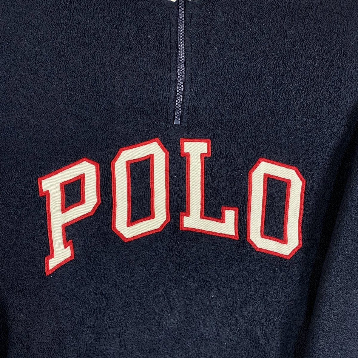 Digg It Thrift & Vintage navy fleece quarter-zip sweatshirt with red and white Polo USA patch lettering