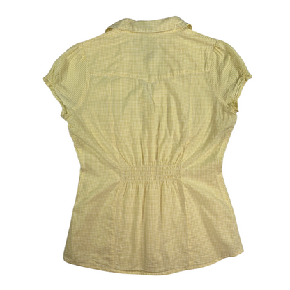 Back view of a Digg It Thrift & Vintage yellow gingham western shirt with short sleeves and a cinched back detail.