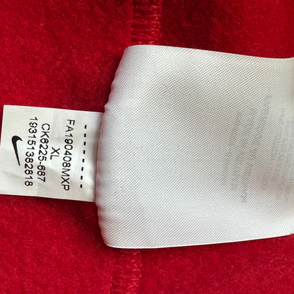 Digg It Thrift & Vintage Nike x Supreme hoodie interior care tag with size XL and product code on red fabric