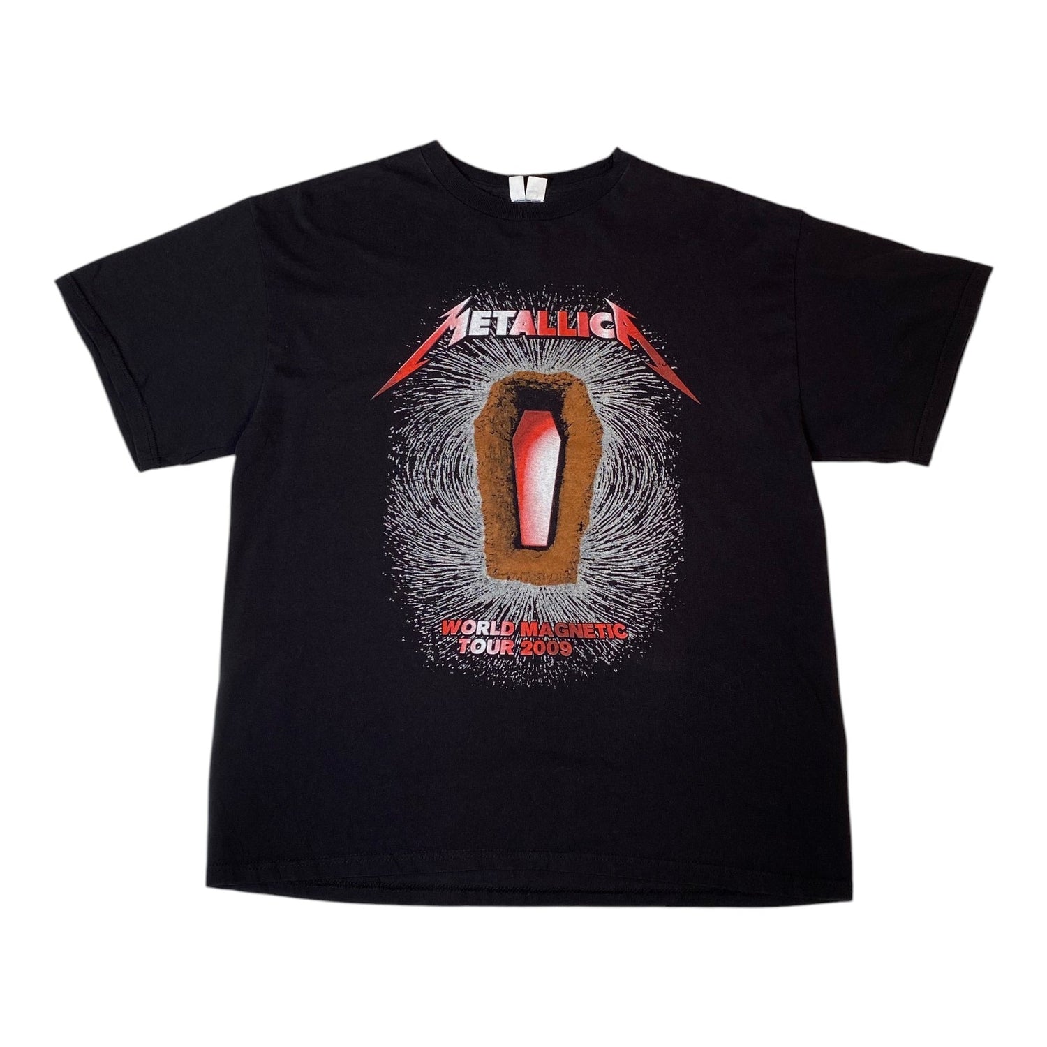 A black short-sleeve Metallica graphic t-shirt featuring the band's name in red and white above a coffin illustration with the text 'World Touring Your Show' on a white background.