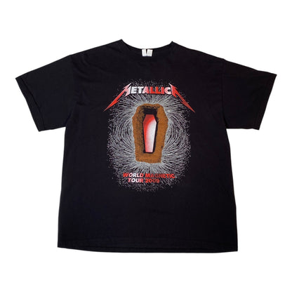 A black short-sleeve Metallica graphic t-shirt featuring the band's name in red and white above a coffin illustration with the text 'World Touring Your Show' on a white background.