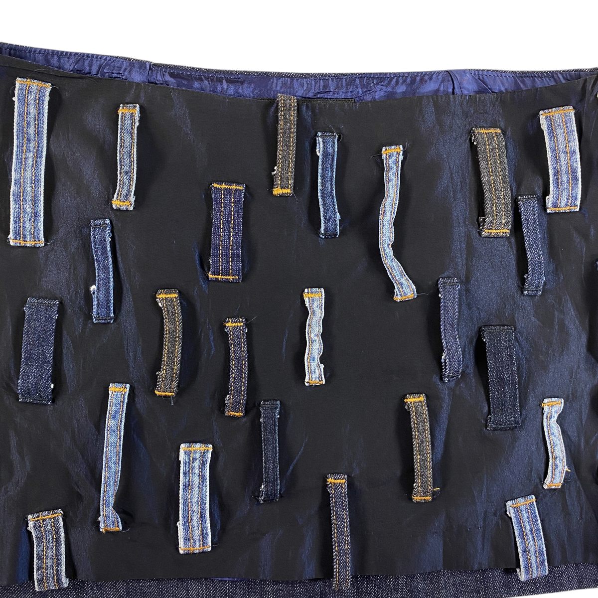 Digg It Thrift & Vintage Miss Sixty denim mini skirt featuring a black base with scattered patchwork belt loops