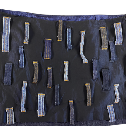 Digg It Thrift & Vintage Miss Sixty denim mini skirt featuring a black base with scattered patchwork belt loops