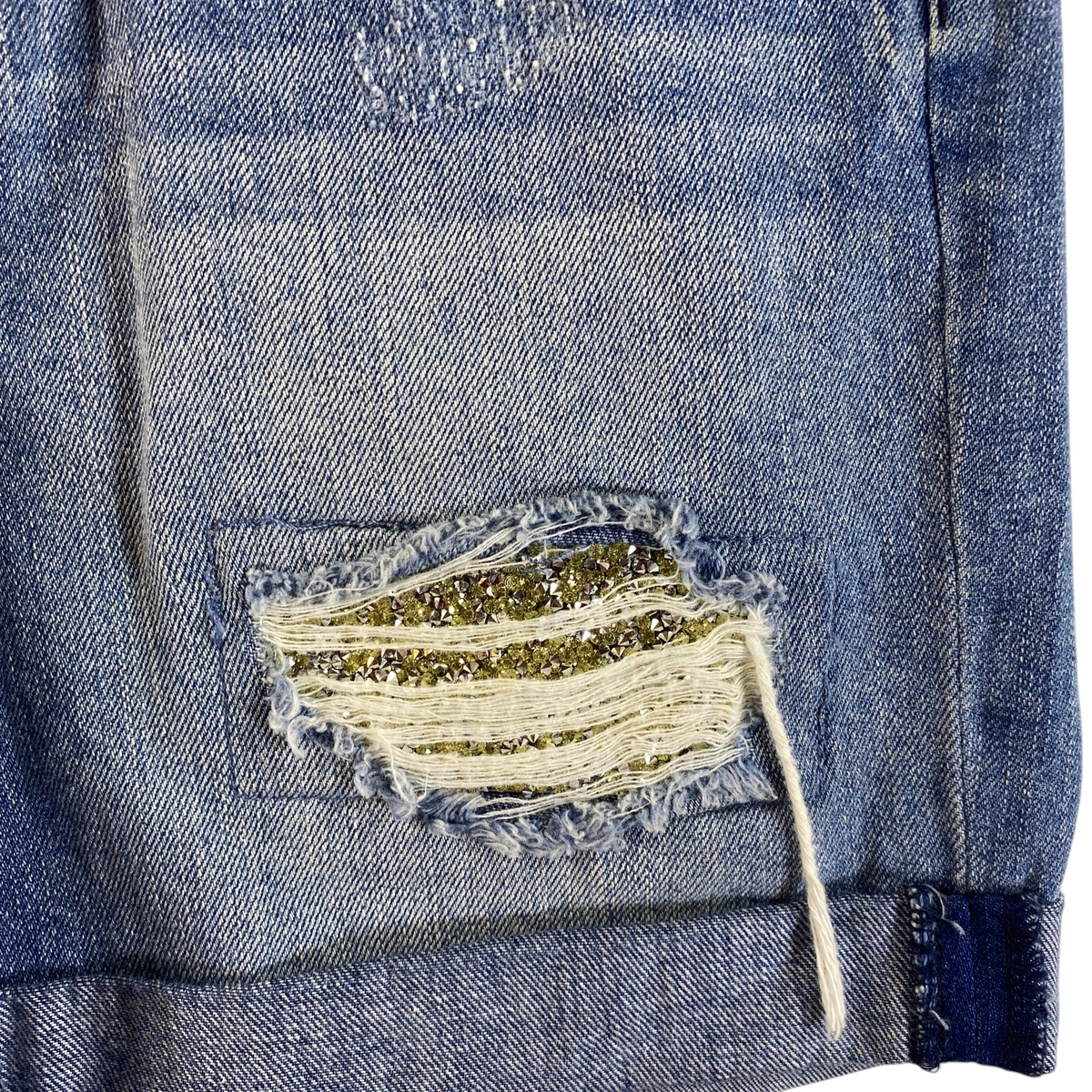 Digg It Thrift & Vintage Juicy Couture distressed denim shorts featuring gold sequin detailing and frayed edges