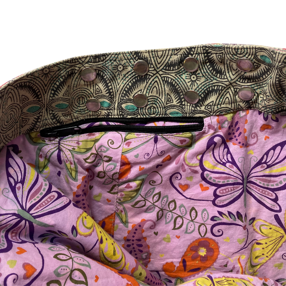 Digg It Thrift & Vintage reversible mini skirt featuring a purple butterfly print and a patterned snap-button waistband.
