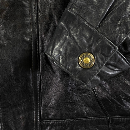 Digg It Thrift & Vintage black Spanish leather bomber jacket sleeve detail with embossed gold-tone metal button