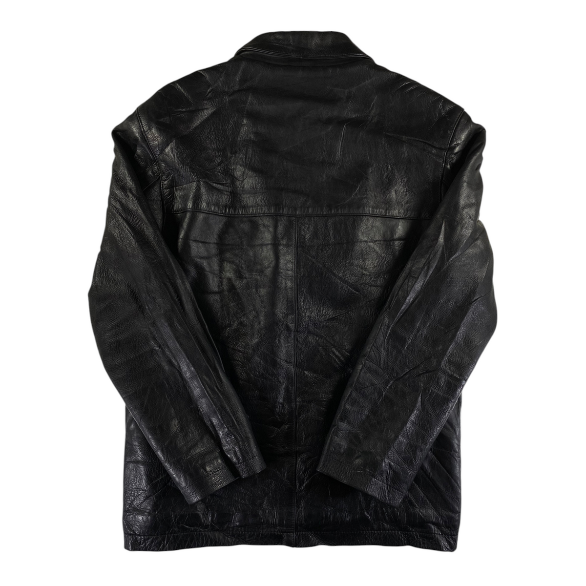Back view of a black leather buttoned jacket from Digg It Thrift & Vintage with a textured finish