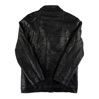 Back view of a black leather buttoned jacket from Digg It Thrift & Vintage with a textured finish