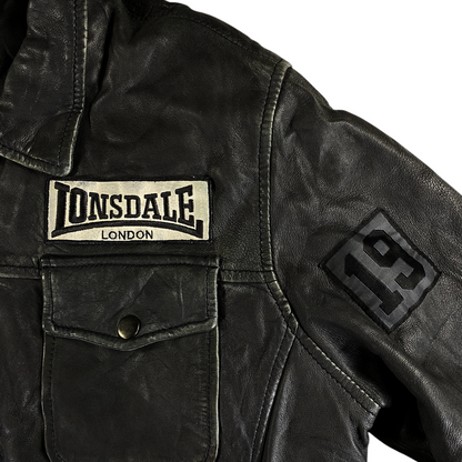 Digg It Thrift & Vintage Lonsdale London black distressed leather moto jacket with graphic patches and chest pocket