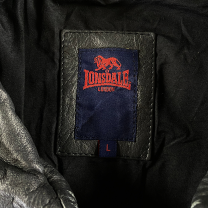 Digg It Thrift & Vintage Lonsdale London leather jacket brand label with red logo on blue patch and size L tag
