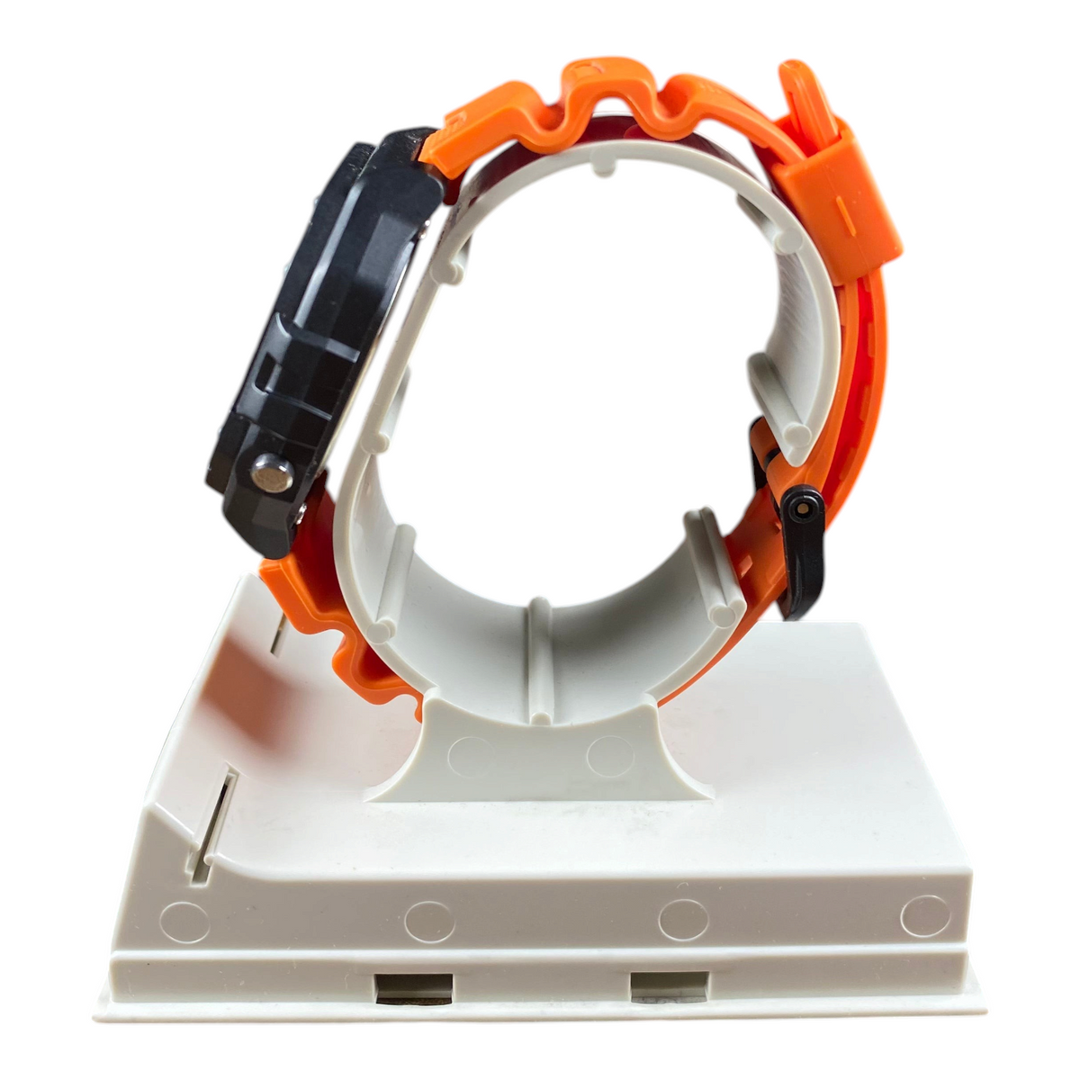 Digg It Thrift & Vintage custom Casio W-218H tactical watch in safety orange with a black case on a display stand.