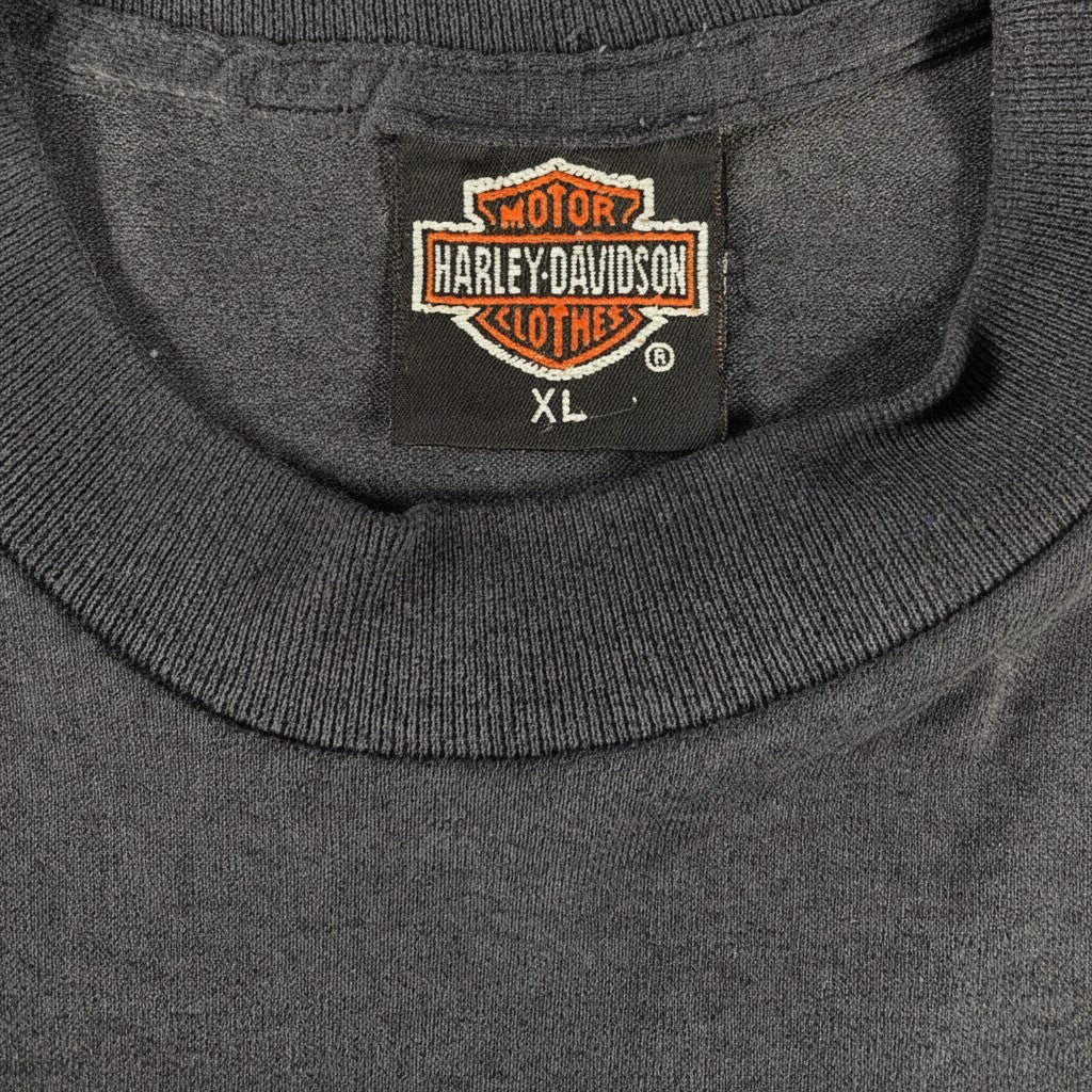 Digg It Thrift & Vintage 1991 Harley Davidson t-shirt neck label showing XL size on faded black cotton fabric.