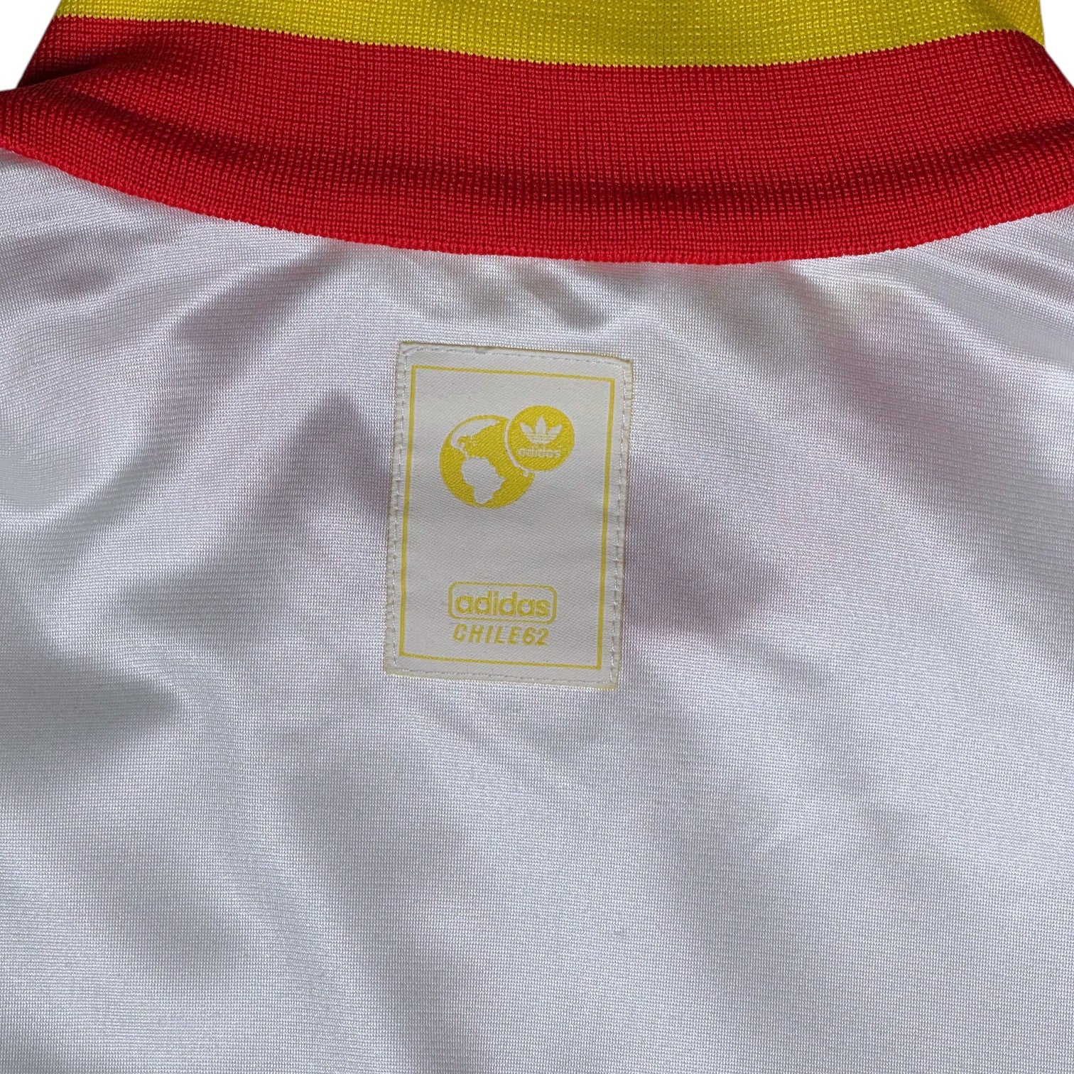 Digg It Thrift & Vintage Adidas Chile 62 white track jacket with yellow and red collar detail and logo tag