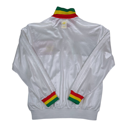 Back view of a white Digg It Thrift & Vintage Adidas Chile track jacket with Rasta-colored collar and cuffs.
